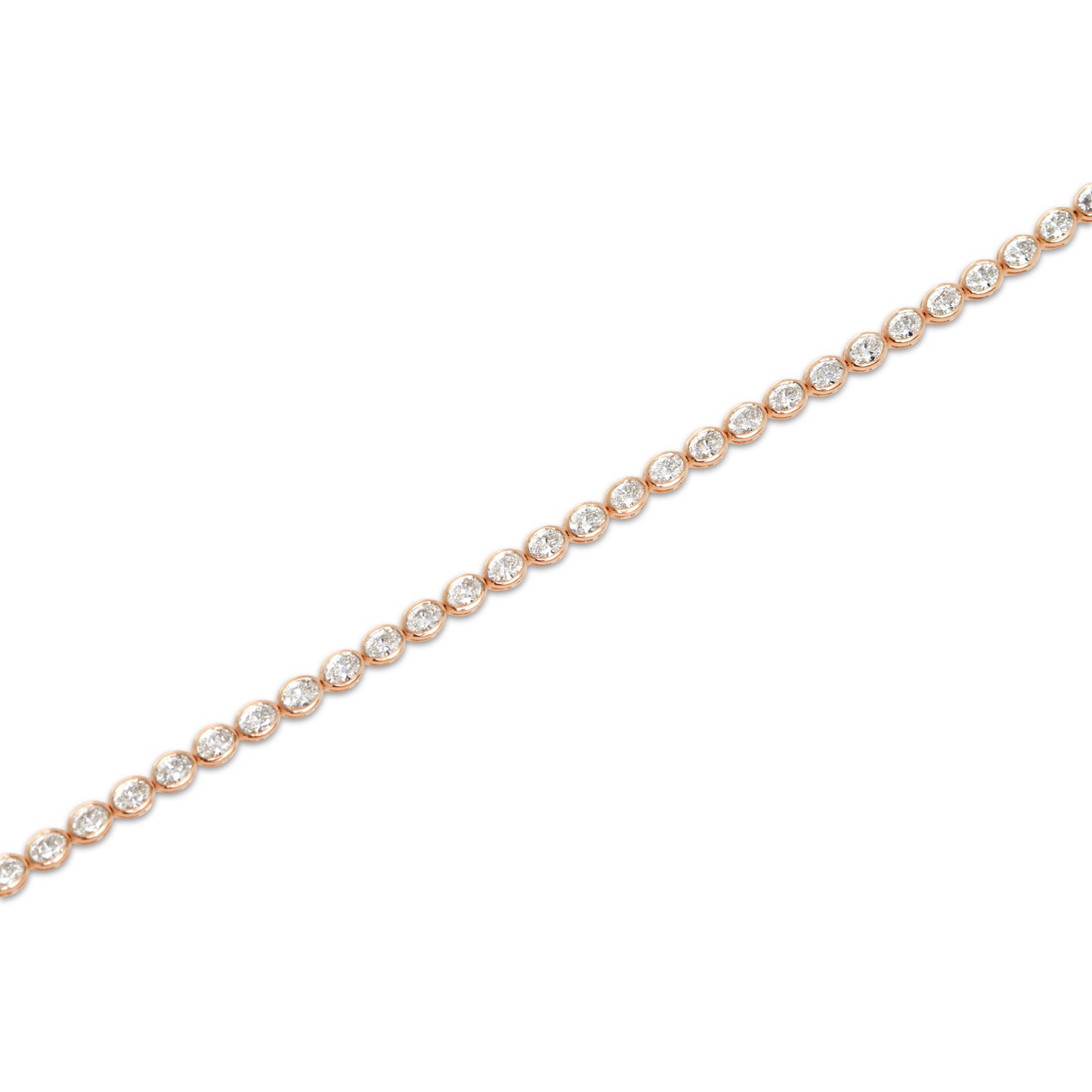 Acute angle view of the Oval Bezel Set East West Tennis Bracelet featuring 5.5ct oval-cut lab-grown diamonds in EF color, VS clarity, set in 14K rose gold, showcasing the elongated bezel settings and elegant curvature of the bracelet