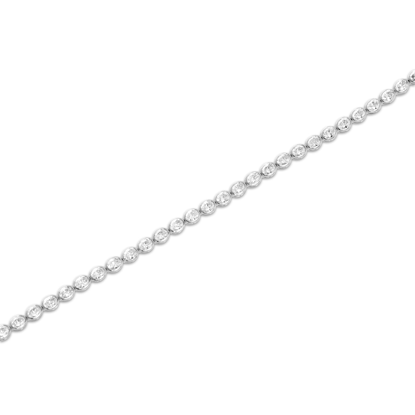 Acute angle view of the Oval Bezel Set East West Tennis Bracelet featuring 5.5ct oval-cut lab-grown diamonds in EF color, VS clarity, set in 14K white gold, showcasing the elongated bezel settings and elegant curvature of the bracelet