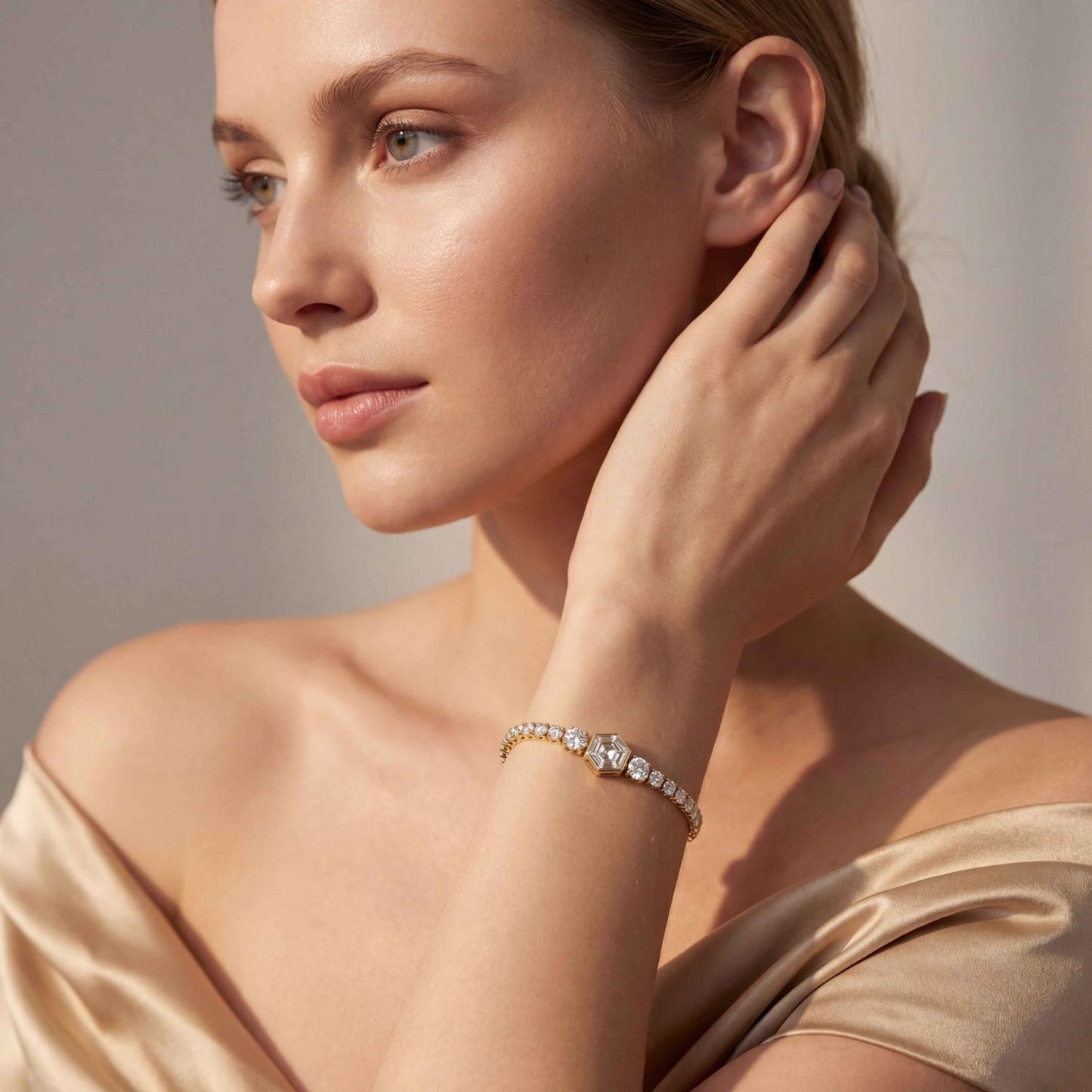 Elegant Valentina graduated tennis bracelet by Lumeniri featuring hexagon center diamond and lab grown stones in 14K gold