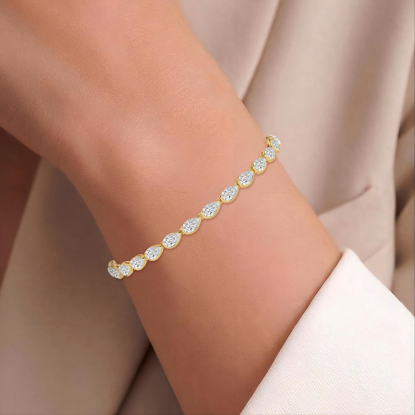 Elegant Zaria bracelet by Lumeniri with pear shaped lab grown diamonds in 5.93 ctw half bezel tennis design
