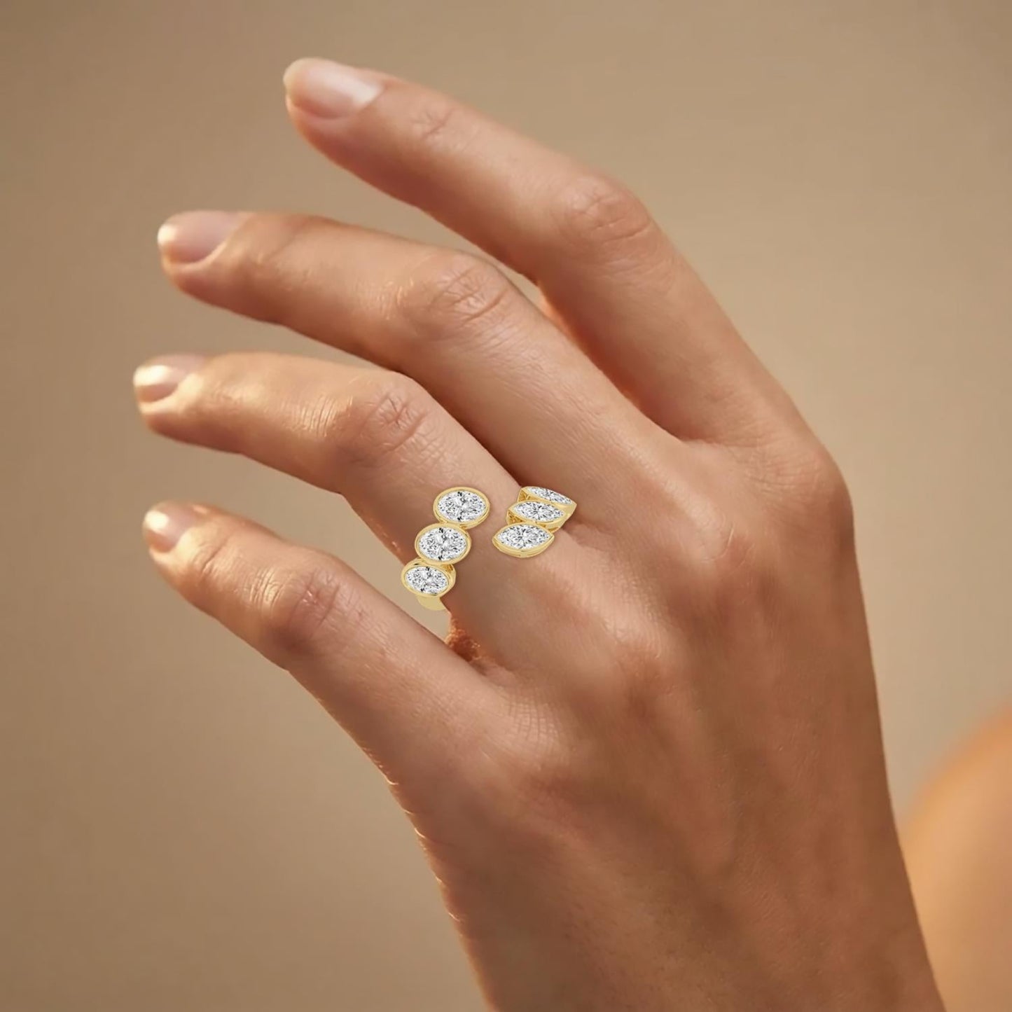 Elegant bypass ring by Lumeniri with oval and marquise lab grown diamonds, sculpted wrap design in 14K yellow gold