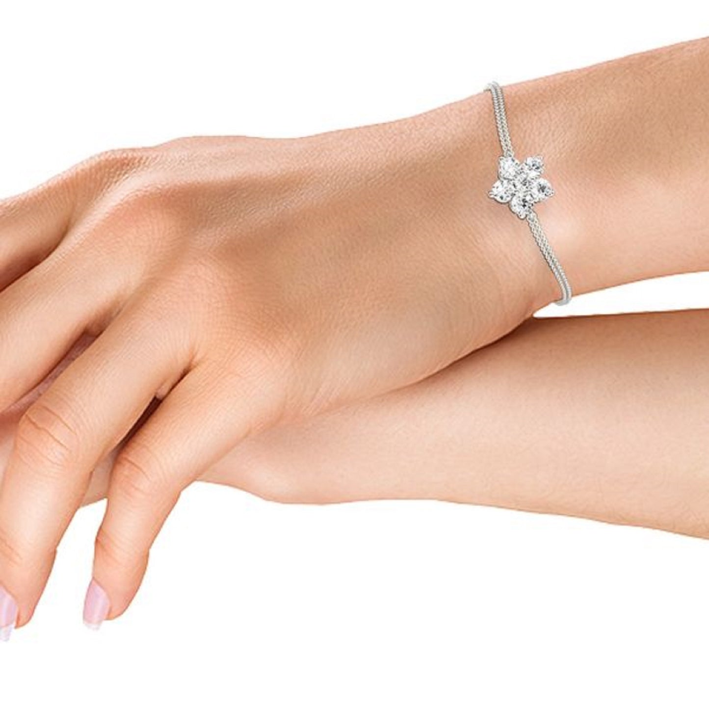 Hand model wearing the Flower Chain Bracelet Double, highlighting floral diamond design and double chain detail in 14k white gold