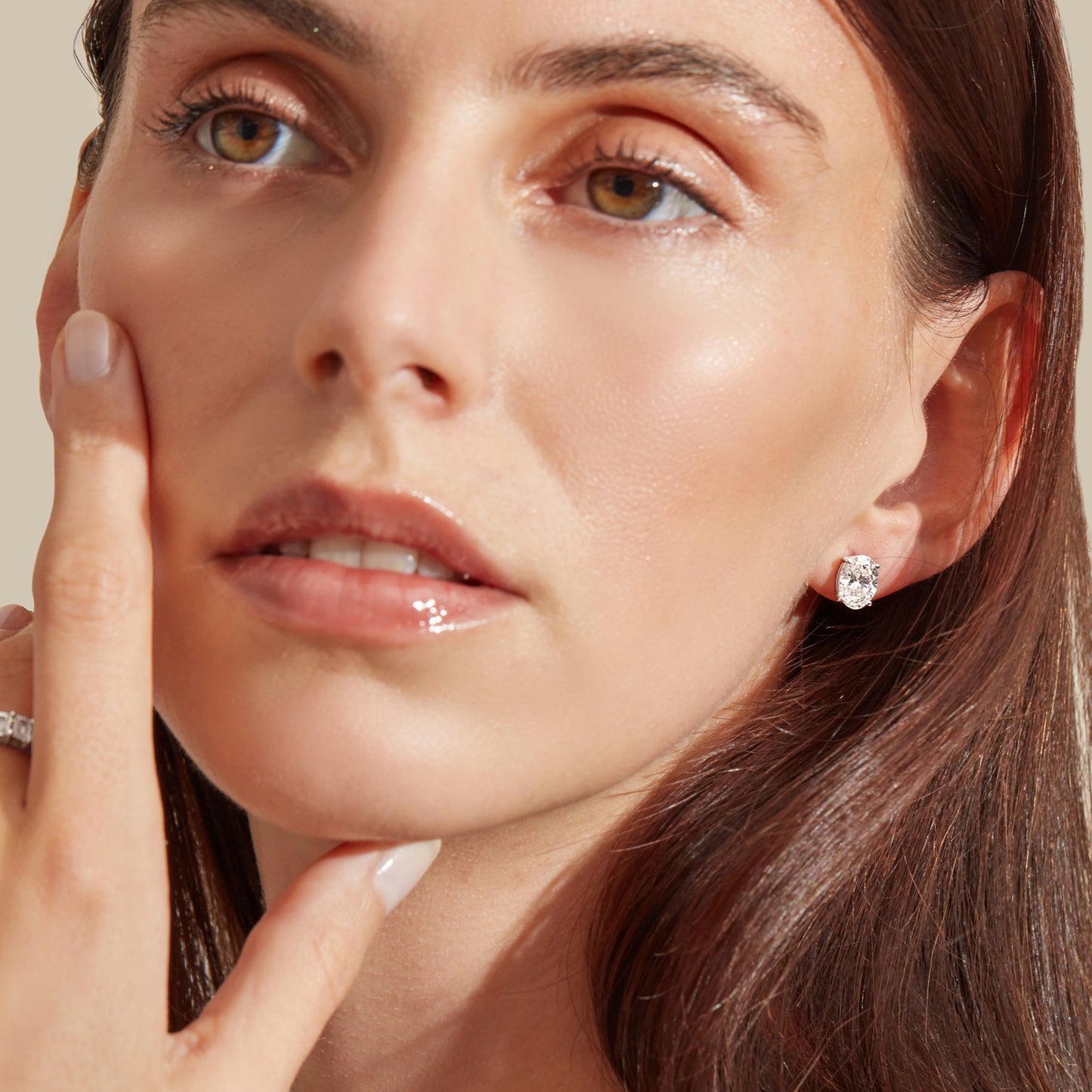 Lumeniri Classic Oval Stud Earrings worn on ear, featuring 1.5cttw of lab-grown diamonds in 14K White Gold, providing timeless elegance and eco-conscious luxury.