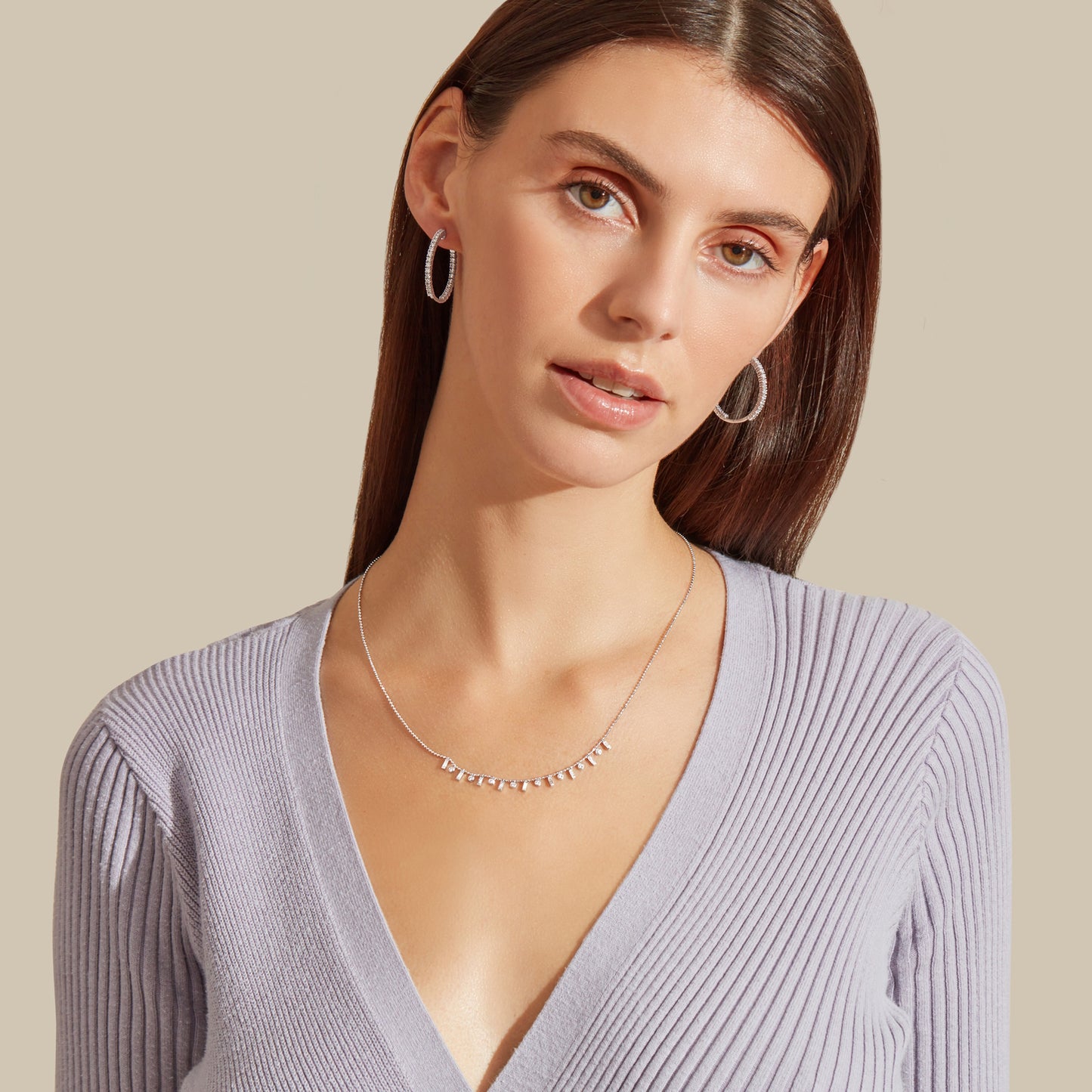 Lumeniri Elinor hoop earrings by Lumeniri worn in layered ear stack, showcasing 2ct lab grown diamonds in modern fine jewelry styling.