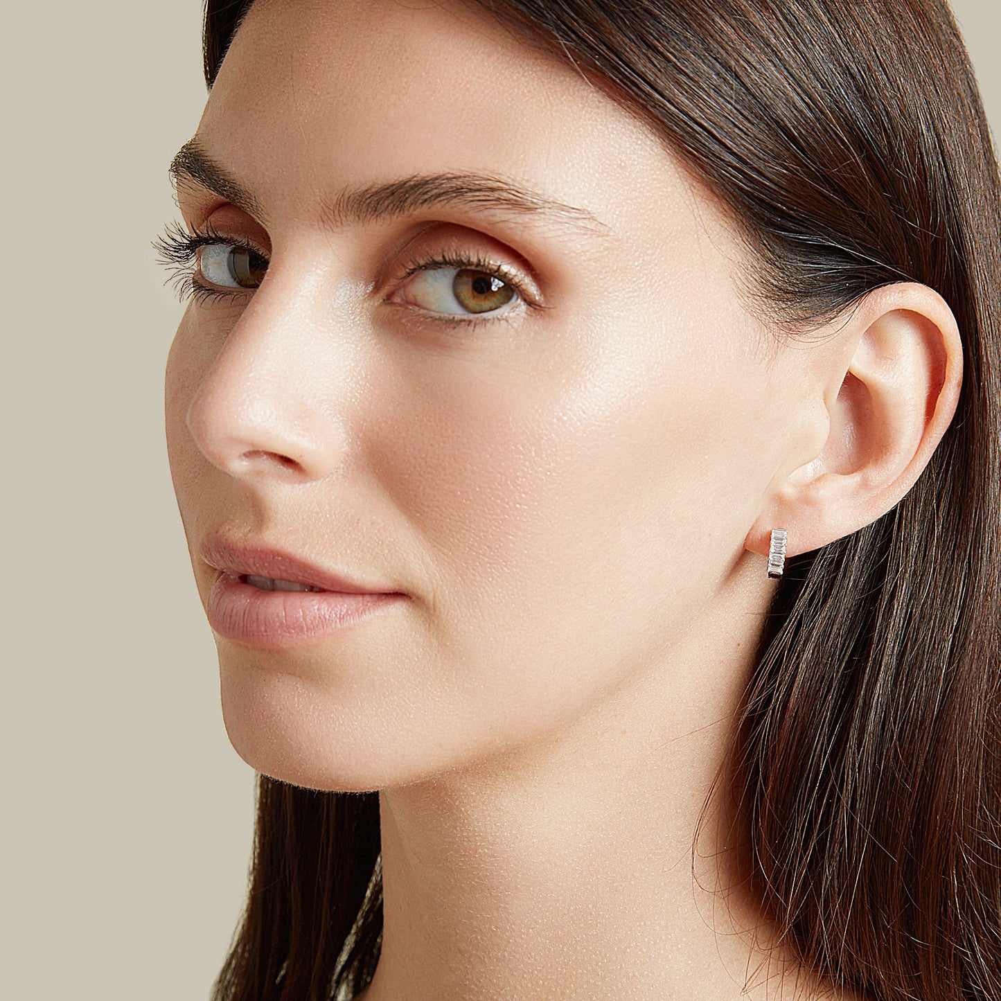 Lumeniri Halina baguette cut huggies worn on ear, showcasing 0.6ct lab grown diamonds in 11mm 14K gold elegant modern fine jewelry styling.