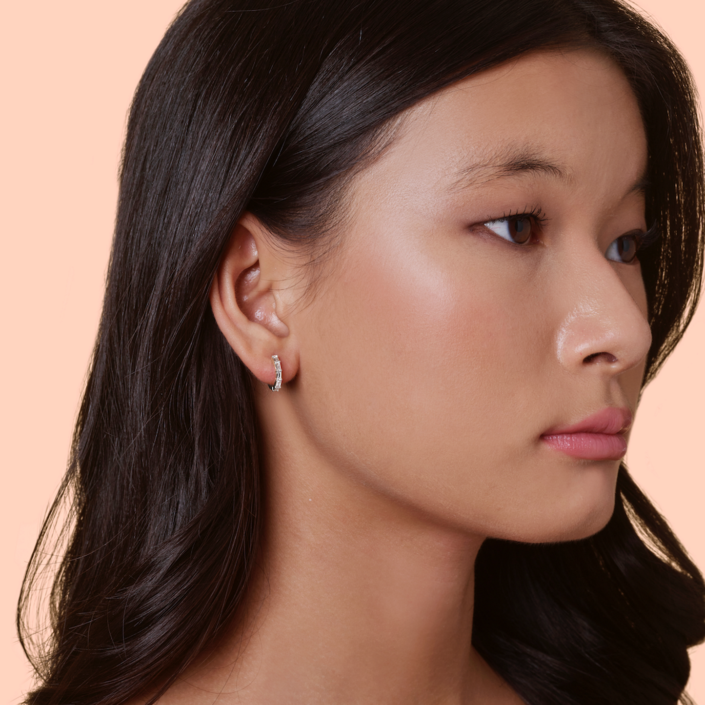 Lumeniri Halina vertical baguette cut huggies worn on ear, showcasing 0.45ct lab grown diamonds in 11mm 14K gold elegant modern fine jewelry styling.