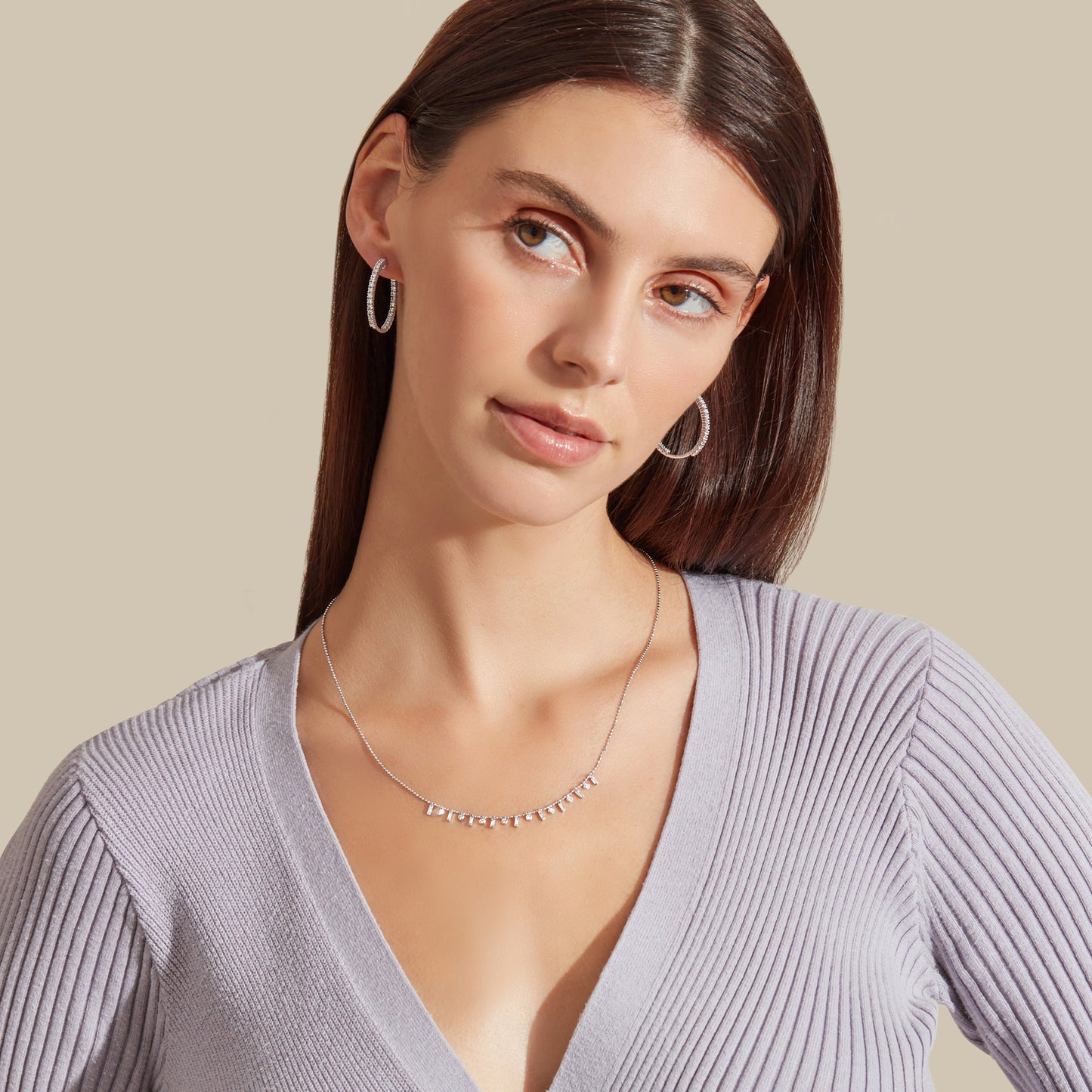 Lumeniri Lumeniri Elinor hoops on ear profile view, highlighting secure fit and brilliant round diamonds in elegant 14K gold craftsmanship.