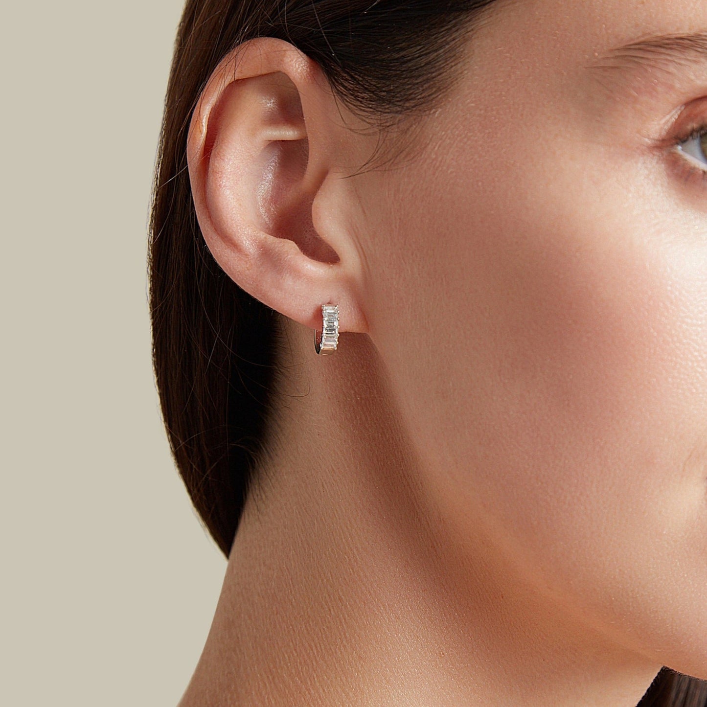 Lumeniri Lumeniri baguette huggie earrings styled on model, highlighting sleek geometric diamond sparkle in refined 14K gold everyday luxury look.