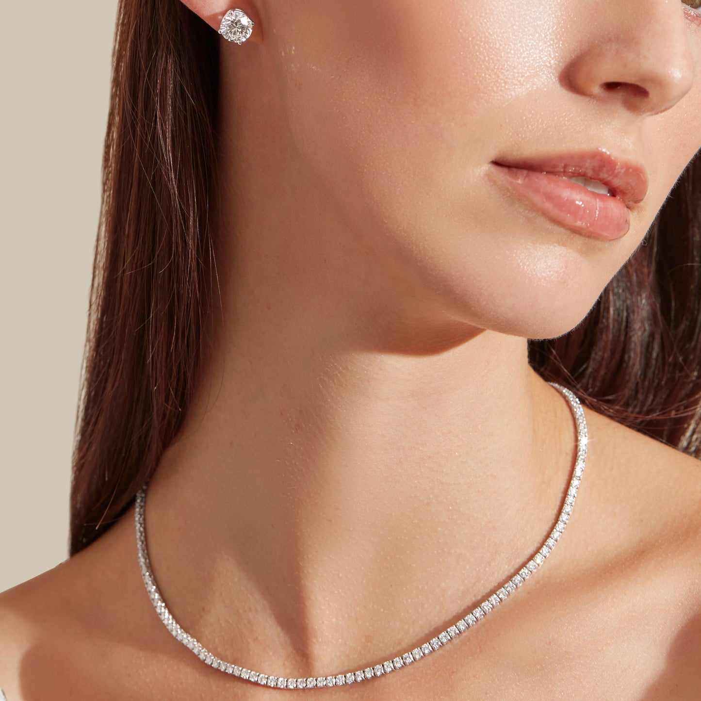 Lumeniri The Claire 8ct lab grown diamond tennis necklace layered on neck, showcasing radiant brilliance in a refined 14K gold luxury statement design.