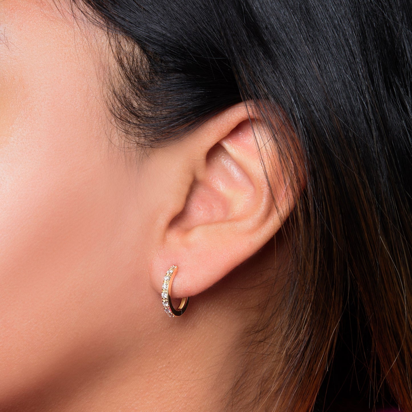 Lumeniri The Eleni hoop earrings worn on ear, showcasing 0.39ct lab grown diamonds in 14K yellow gold elegant modern fine jewelry styling.
