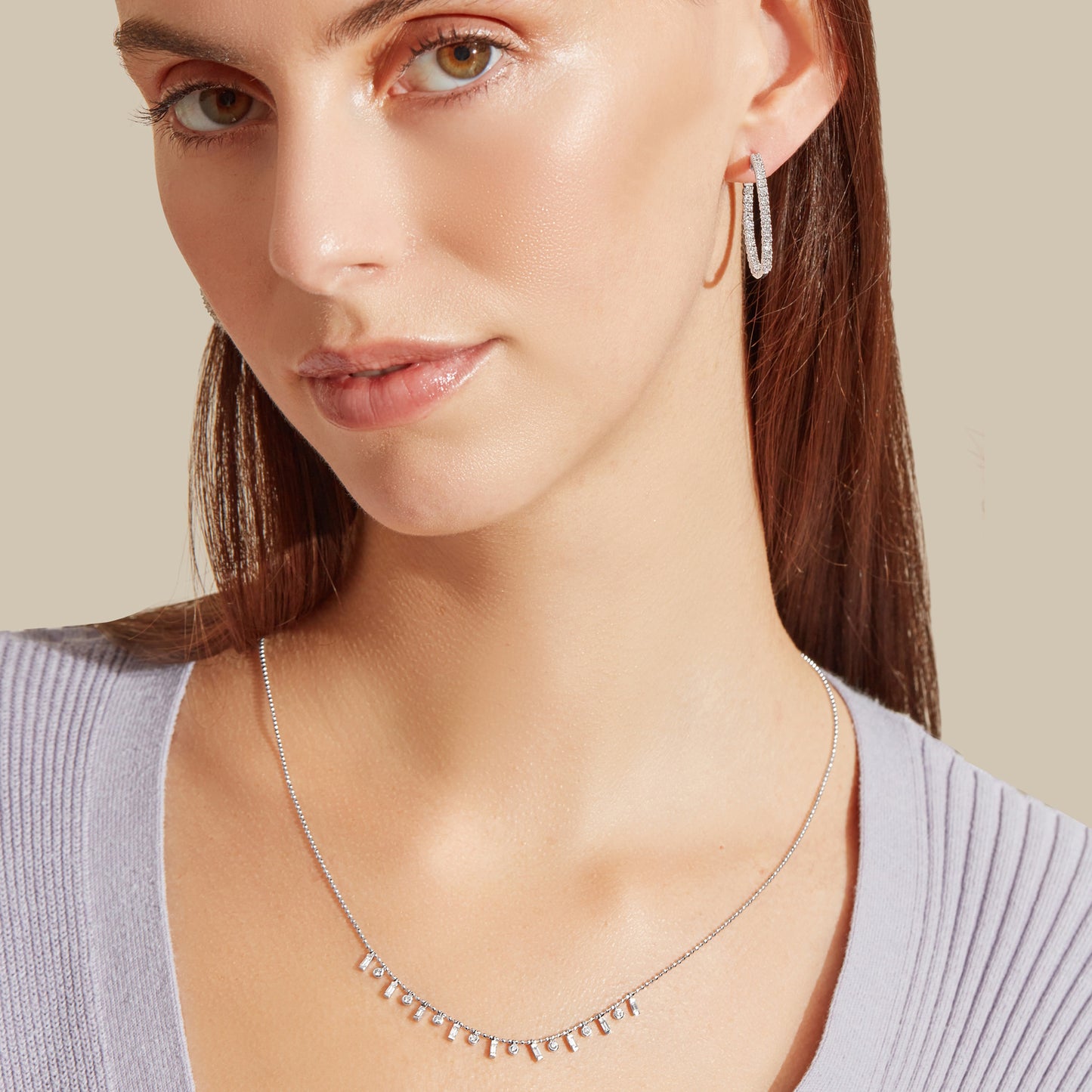 Lumeniri The Elinor diamond hoop earrings worn close-up, showing radiant round cut lab grown diamonds in 14K gold statement jewelry design.