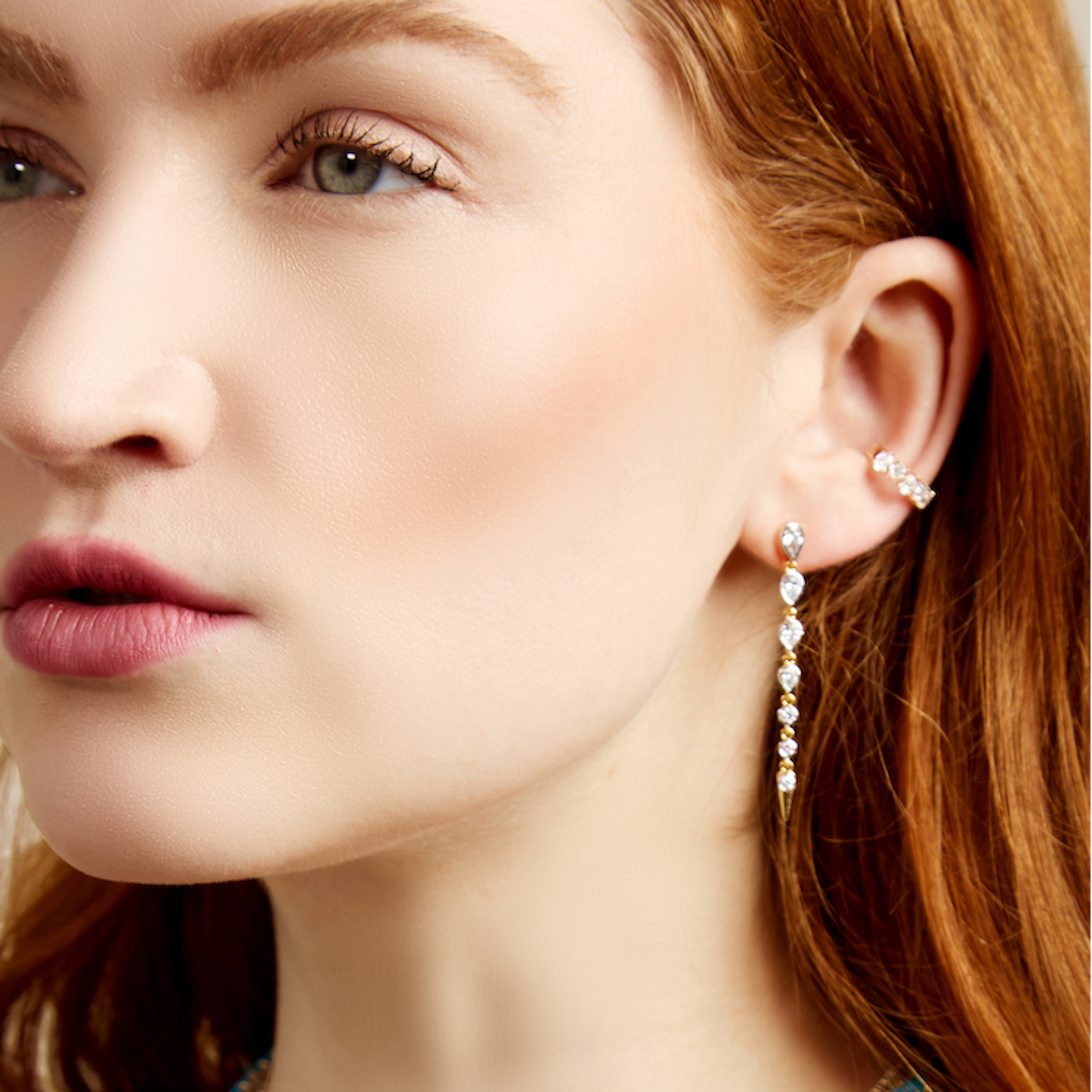 Lumeniri The Helene Pear Alternating Earcuff worn on ear, showcasing 0.52ctw pear shaped lab grown diamonds in a sculptural 9mm 14K gold cuff design, modern genderless fine jewelry styling.