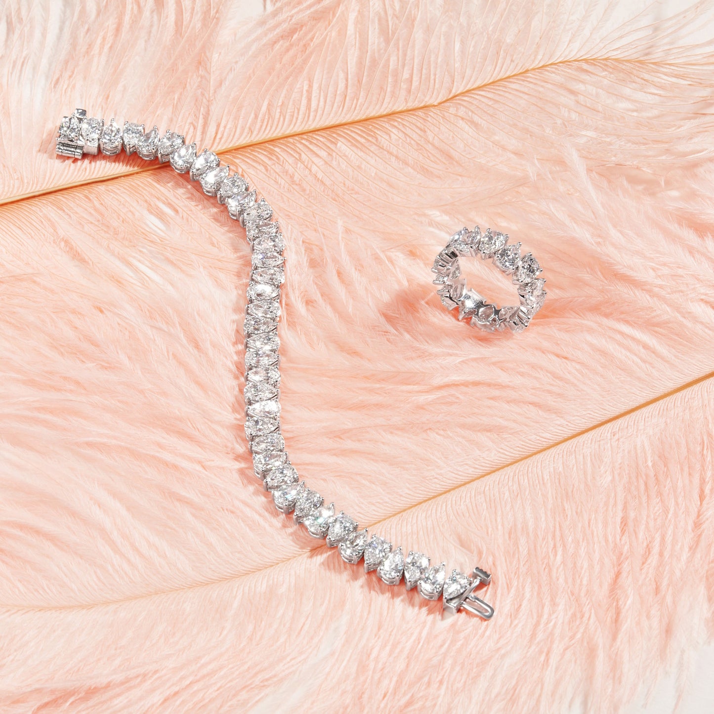 Lumeniri The Orya Alternating Pear Tennis Bracelet worn on hand, showcasing 15ct lab grown pear diamonds in 14K white gold Riviera setting, elegant modern luxury fine jewelry styling.