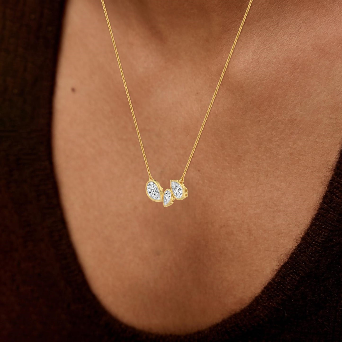 Lumeniri lab grown diamond pendant showcasing mixed shape three-stone drop on polished mirror chain