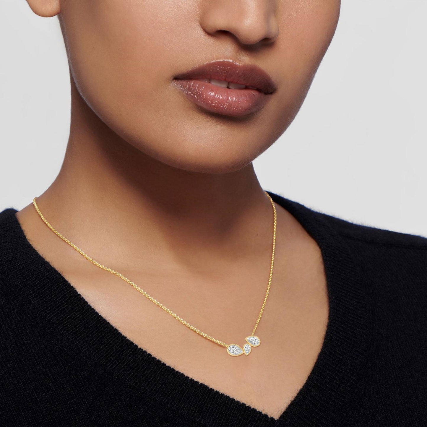 Lumeniri three stone pendant with mirror chain detailing and lab grown diamonds in modern yellow gold setting