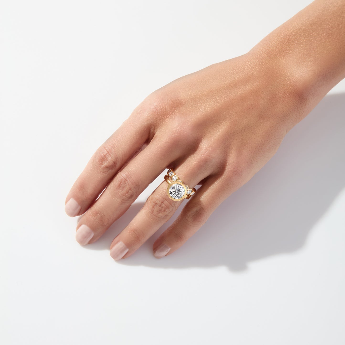 Modern eternity band by Lumeniri featuring 2.00 CTW round diamonds in a refined bezel setting for everyday wear.