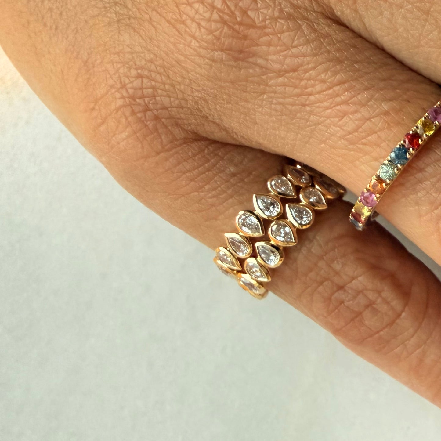 Nova Pear Half Eternity Pinky Ring showcasing alternating pear-shaped lab-grown diamonds in 14K gold