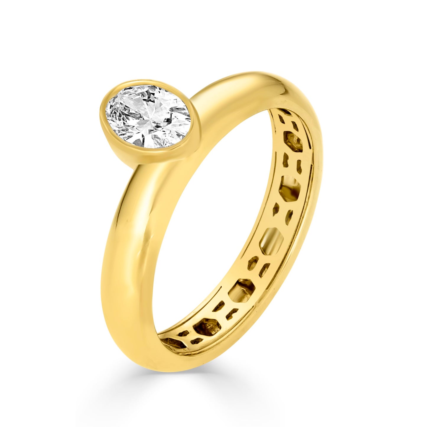 Lifestyle shot of the Nadia Offset Oval Ring stacked with other Lumeniri rings, featuring 14K yellow gold and a 0.5ct oval-cut lab-grown diamond.